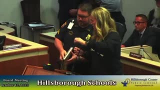 Cop stops mom from exposing what's in book available to kids, school district panics