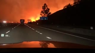 Helicopter Drops Water on Intense Fire