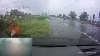 Truck Causes Close Call on Rainy Road