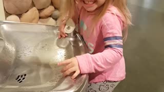 Little Girl Vs. Drinking Fountain