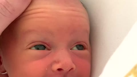 Baby reacts to head massage