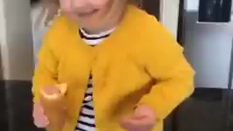 Toddler Girl with Corn Dog Dances