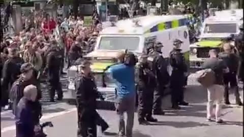 Irish⧸British nationalists in Belfast standing side by side protesting against mass immigration!