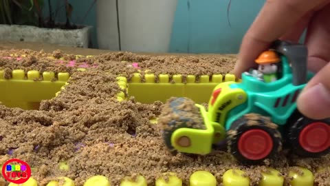 Cars Toys Bridge Construction on the Sand with Dump Truck, Loader, Bulldozer Video for Children