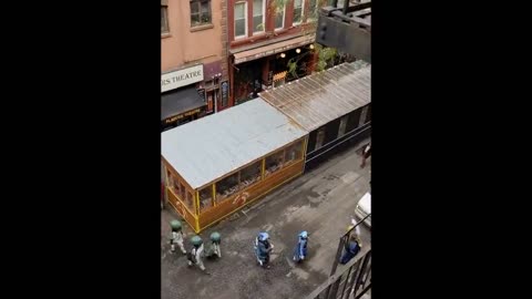 Marching band dressed in costumes plays "When The Saints Go Marching In" on NYC street