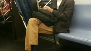Man in wizard old man costume on train