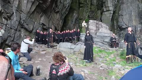 Nordic Folk Group Performs Funeral Song On Side Of Mountain