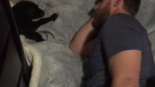 Husband falls asleep on the floor watching his dog sleeping