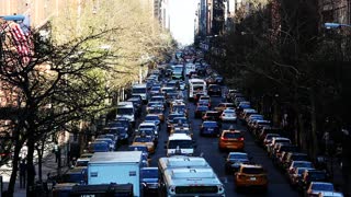 Cars Driving In Traffic on the Streets