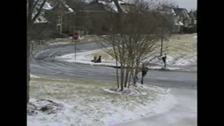 Kid Sleds Down Sidewalk And Racks Himself On A Stop Sign