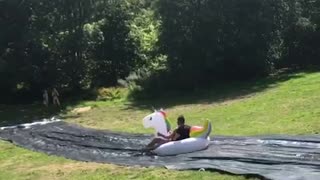 Two people unicorn slip and slide fail
