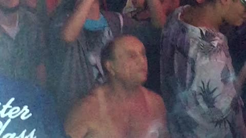 Music shirtless guy dancing at concert