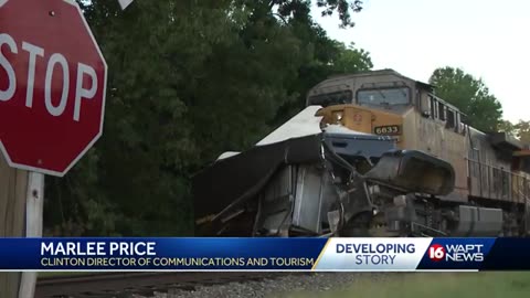 Train crashes into UPS truck in Clinton