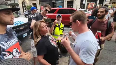 New York: A man eats a kabab in front animal rights activists while they shriek.