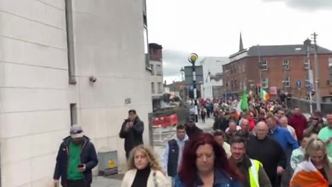 Large numbers of people out in limerick protesting against the government open