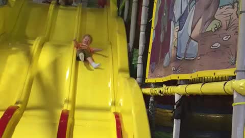 Cute kid sliding