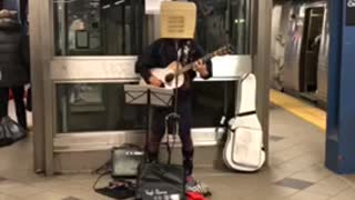 58 mezzanine street elevator guy basket head guitar subway