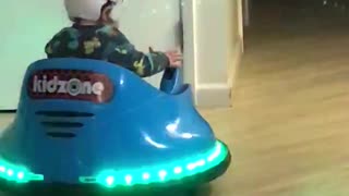 12 month old driving his bumper car
