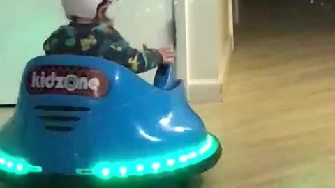 12 month old driving his bumper car