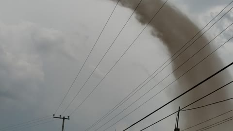 Whirling Tornado Spawns from Thunderstorm over Hidalgo