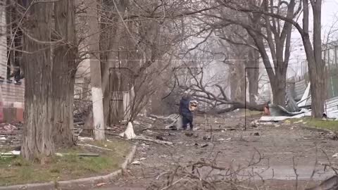 Russian marines take the lost grandmother out of the battlefield