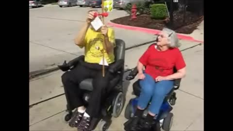 Two Seniors Drag Race In Electric Wheelchairs