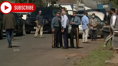 Joe Biden takes barrage of heckles from people behind Fence waving Trump flag touring Hurricane Ida