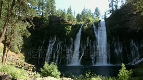 Beautiful waterfall in green forest,