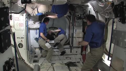 Shuttle Crew Welcomed Aboard Space Station