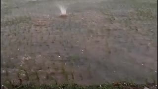 Huge Hail Landing in Flooded Field