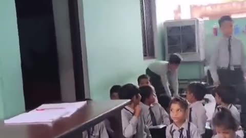 A Hindu school teacher in India, asking Hindu kids in the class to hit a kid as he is Muslim!