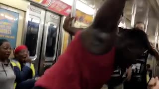 Red tank top man does backflip on subway and clapping crowd screams