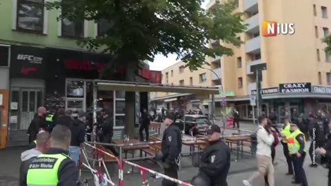 The moment the axe wielding man is shot by police in Hamburg.