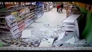 Supermarket Booze Aisle Shelves Collapse As Man Walks By