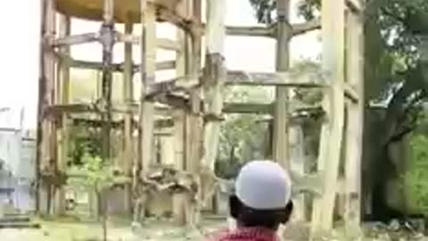 See a Small Water Tower Being Demolished