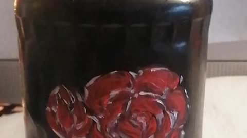 Acrylic painted glass jar with red flowers