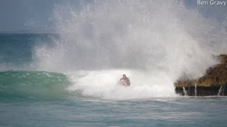 Surfer Makes a Tight Squeeze