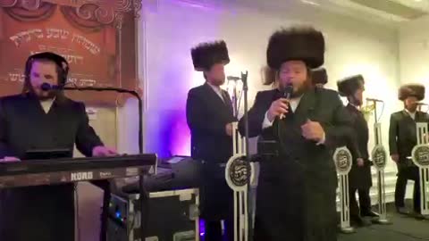 Levy Falkowitz singing “Beigela” at a recent wedding