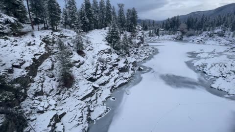 Throwing Snow Onto Icy River