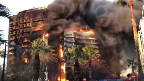 New: An entire multi-story building is on fire in Valencia, Spain.