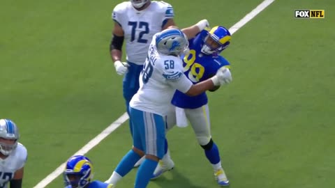 Aaron Donald SCRAP with Penei Sewell after play