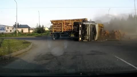 Logging Truck Tips over while Turning Sharp Corner