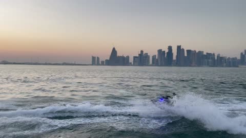 High speed water bike racing with water spray