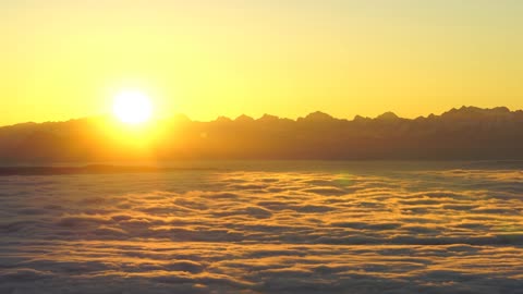 Above The Clouds - 4K - Sunrise Over The Alps - Free HD Stock Footage - No Copyright