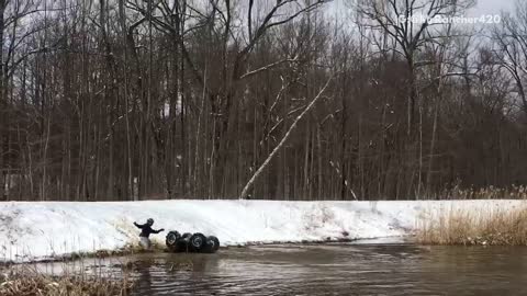 Man rides four wheeler out of lake only to have it roll over back into water