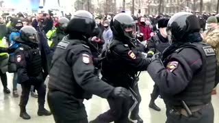 Moscow police grab Navalny supporters before rally