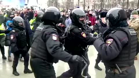 Moscow police grab Navalny supporters before rally