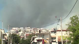 Athens wildfire reaches suburbs as Greece calls in Europe's help