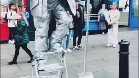 Funny silver man statue
