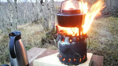 Cocking on a tin can stove.